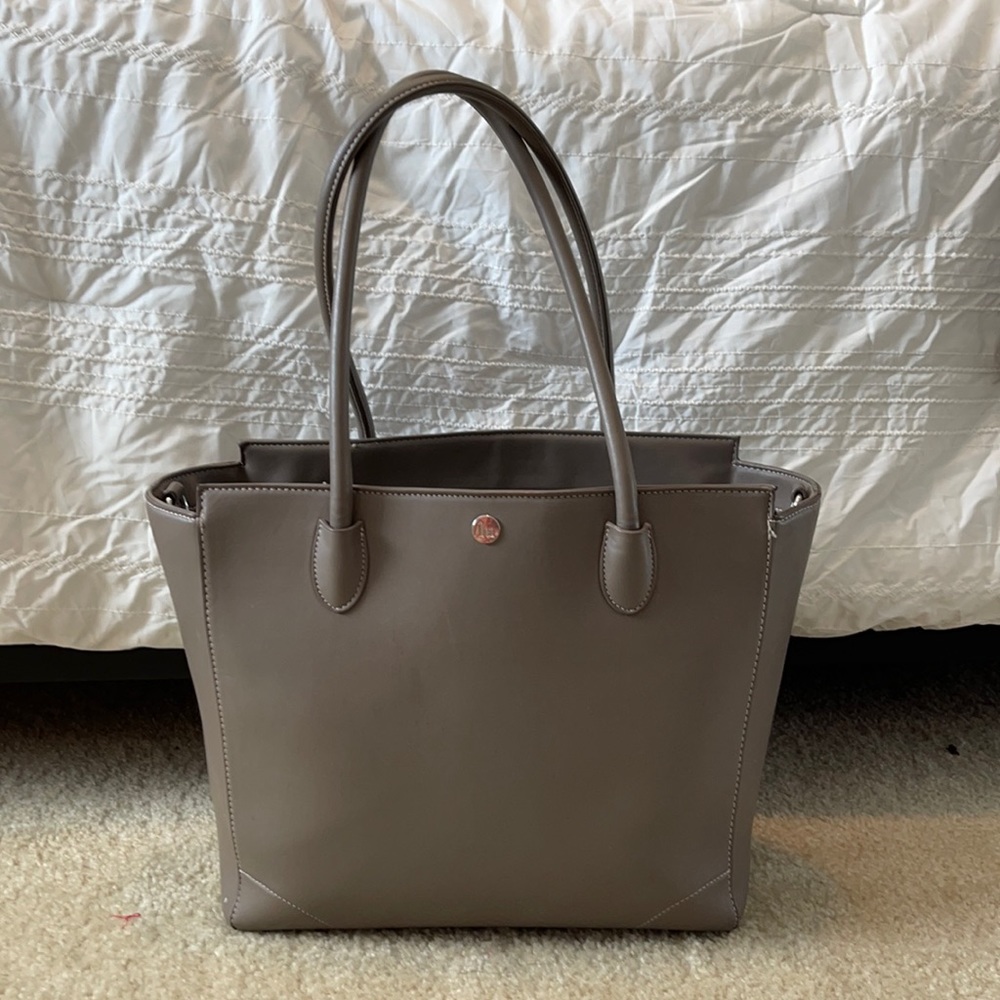 Little Unicorn tote diaper bag, light grey with white/ grey stripe inside.